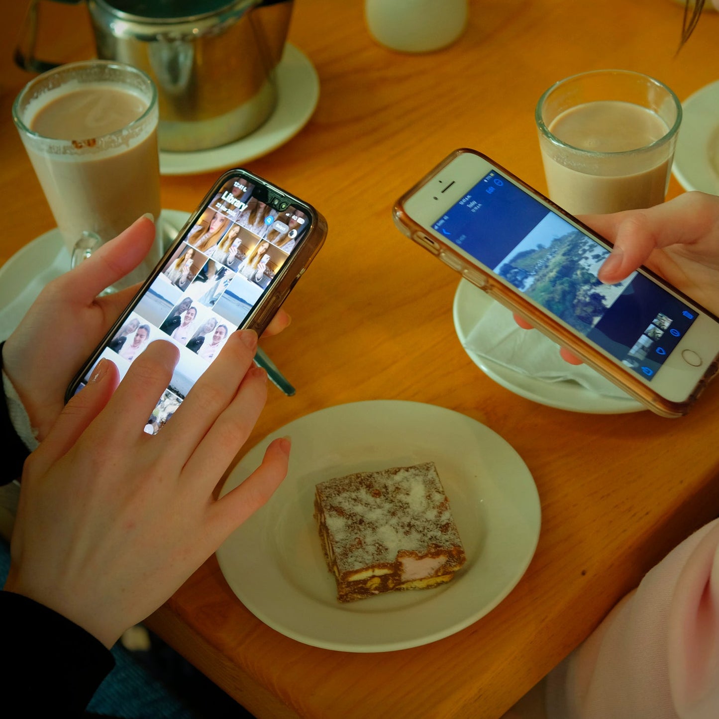 Participants choosing their favourite photos and creating their unique postcards over a cup of coffee after the photowalk