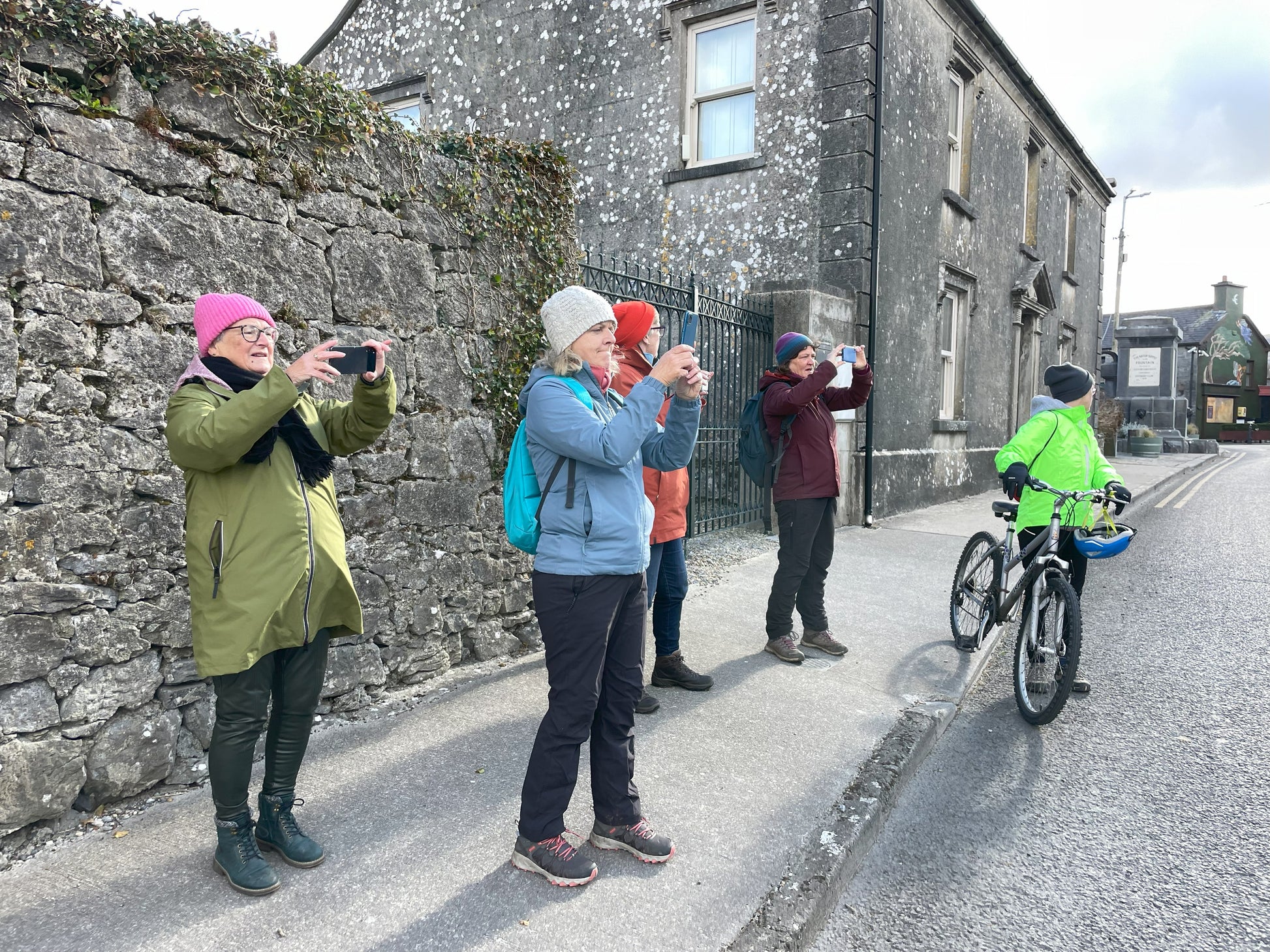 Photowalk participants talking photos on the street in Ballyvaughan