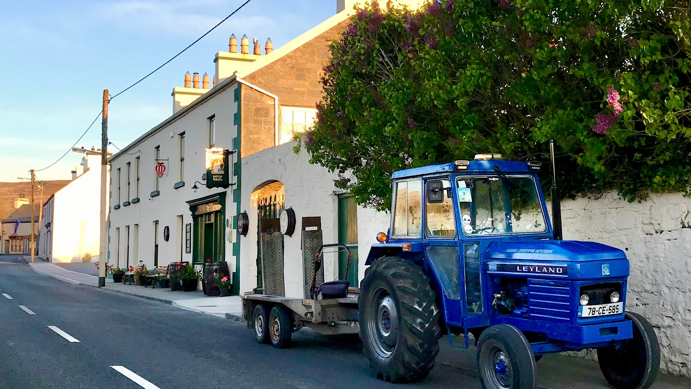 A blue tractor parked outside O Lochlainn's Whiskey Bar in Ballyvaughan, County Clare. Photograph by Claire O'Rorke