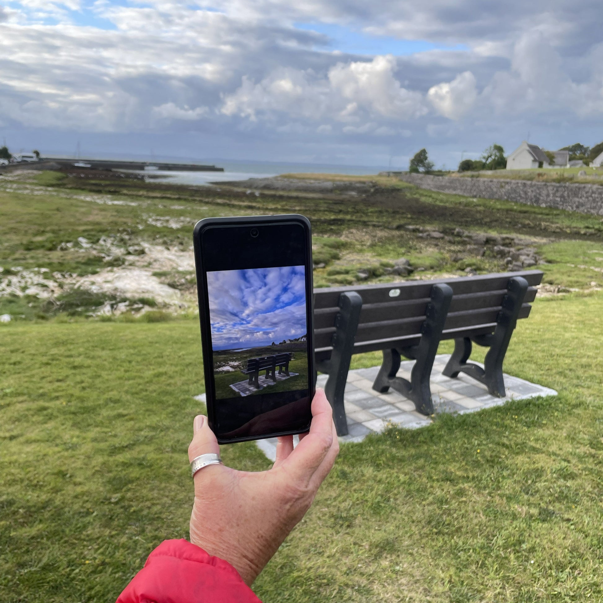 A participant learning how to use exposure at the seafront in Ballyvaughan